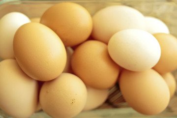 Chicken eggs in a glass bowl
