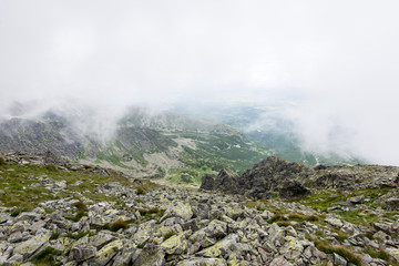 rocky mountain landscape covered with clouds