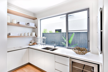 Modern kitchen utensil store with a window and counter