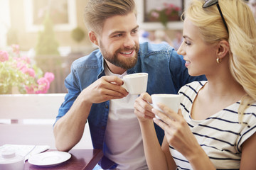 Woman with man drinking coffee together