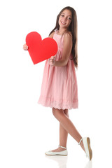 Fototapeta na wymiar Lovely girl holding a red heart shape, over white background. Love concept