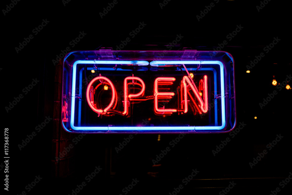 Wall mural neon OPEN sign welcomes customers