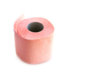 Pink toilet paper on white background