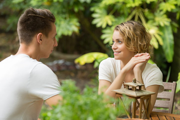 Fototapeta premium young happy beautiful couple speaking summer time