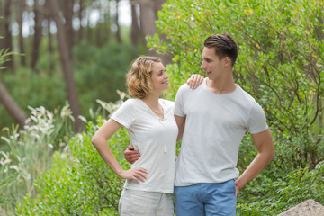 Fototapeta premium young happy couple walking in the park