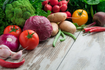 Fresh vegetables on a wooden table.