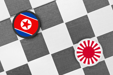 Draughts (Checkers) - North Korea vs Japan. Conflict between Japanese and Korean state. Threat of...