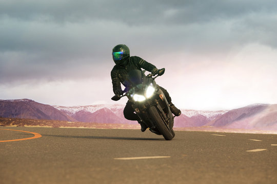young man riding big motorcycle on asphalt highway ,use for peop