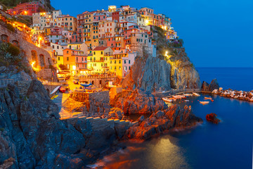 Aerial night view of Manarola fishing village, seascape in Five lands, Cinque Terre National Park,...