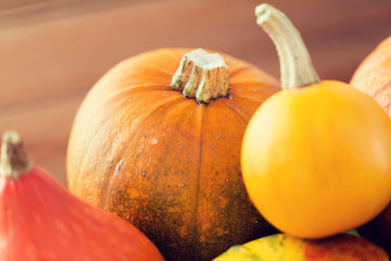 close up of pumpkins on wooden table at home