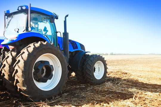Blue tractor in a field