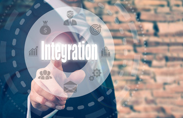 A businessman selecting a Integration Concept button on a circular panel