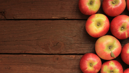 Apples on wooden background