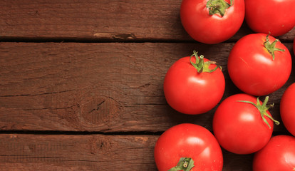 Tomatoes on wooden background