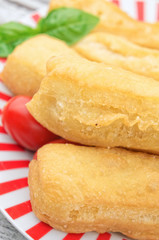 Fried bread sticks  on wooden table