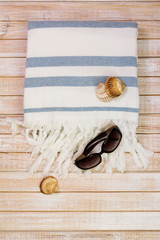 woman beachwear set, overhead, on wooden background.