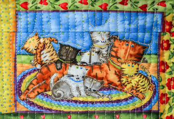 SUZDAL, RUSSIA - JULY 16, 2016: Feast of cucumber in Suzdal, handmade quilt depicting cats