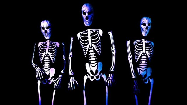 three funky disco skeleton Halloween cool dance