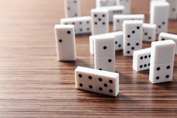 Heap of dominoes on wooden background