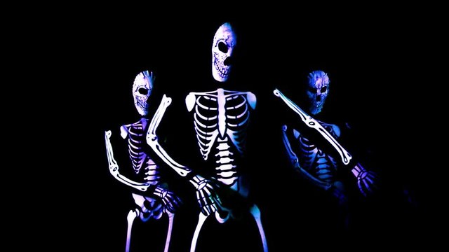 three funky disco skeleton Halloween cool dance