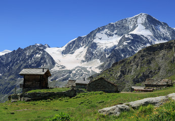 Fototapeta na wymiar Huts of Pra Gra Remointse in the mountains near Arolla, Switzerland.