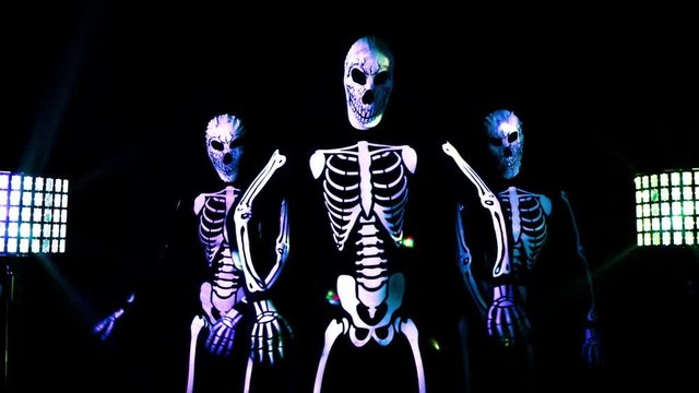 three funky disco skeleton Halloween cool dance