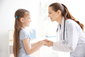 Cute girl visiting a doctor