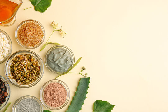 Natural ingredients in glass bowls for skin care on light background