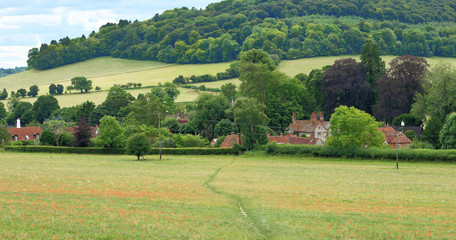 Fototapeta na wymiar An English Summer Landscape with a Village in the Valley