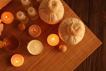 Composition of spa treatments with candles, top view