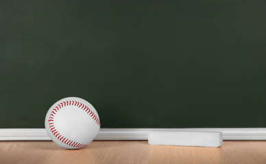 Tennis ball on green blackboard background