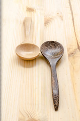 Wooden kitchen spoons on wooden table