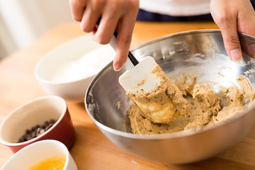 Mixing paste inside bowl by hand