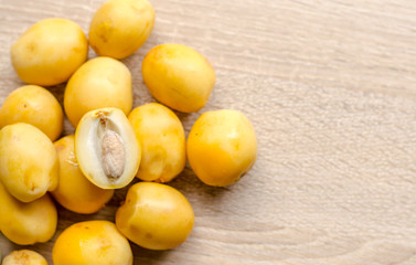 fresh date palm fruits  on wooden background
