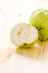 The tropical fruit high vitamin c, fresh guavas on wood backgrou