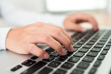 Woman working on laptop computer at home