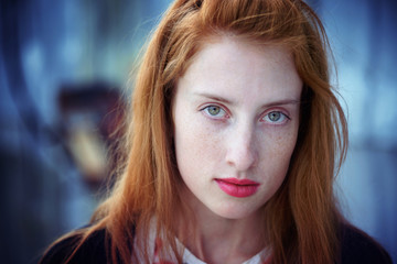 Fototapeta na wymiar Portrait of a beautiful redhead girl
