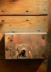 Old rusty lock of antique wood door