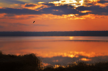 Sunrise over the lake early in the morning with beautiful clouds