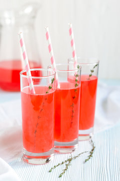Pink fruit lemonade in tall glasses