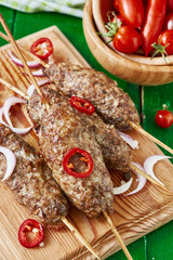 Traditional shish kebab from lamb meat with vegetables.top view.