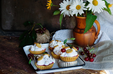 pastry tartlets with meringue and cherry