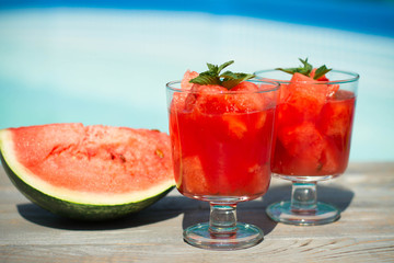 Melon juice in the glass on the wooden table