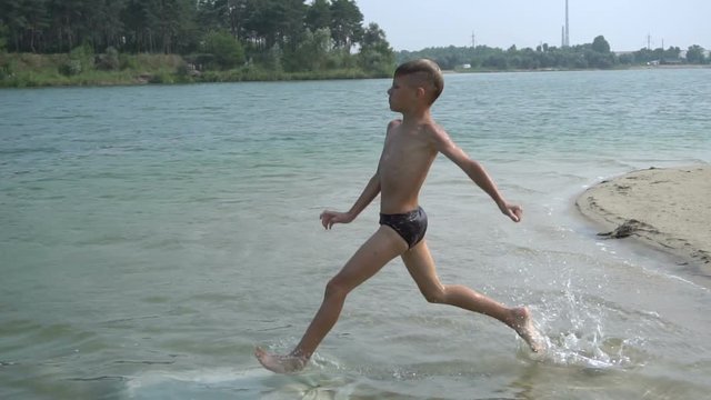 Boy makes a jump in the lake