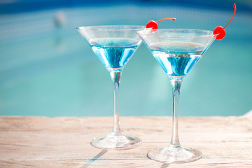 Blue cocktail with a cherry