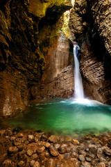 Fototapeta na wymiar Kozjak waterfall in Triglav natioanl park in Slovenia. Long exposure technic with motion blurred water