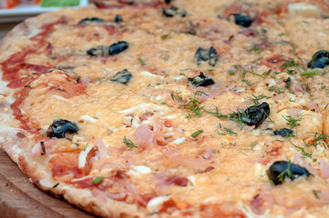Delicious italian pizza served on wooden table.
