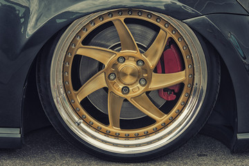 Close-up of aluminium rim of luxury car wheel