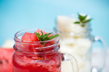 Melon juice in the glass on the wooden table