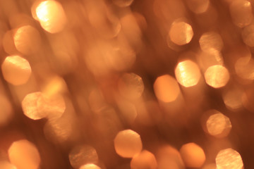 Festive gold background with bokeh effect